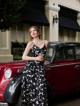 A lady wears a silk maxi dress.